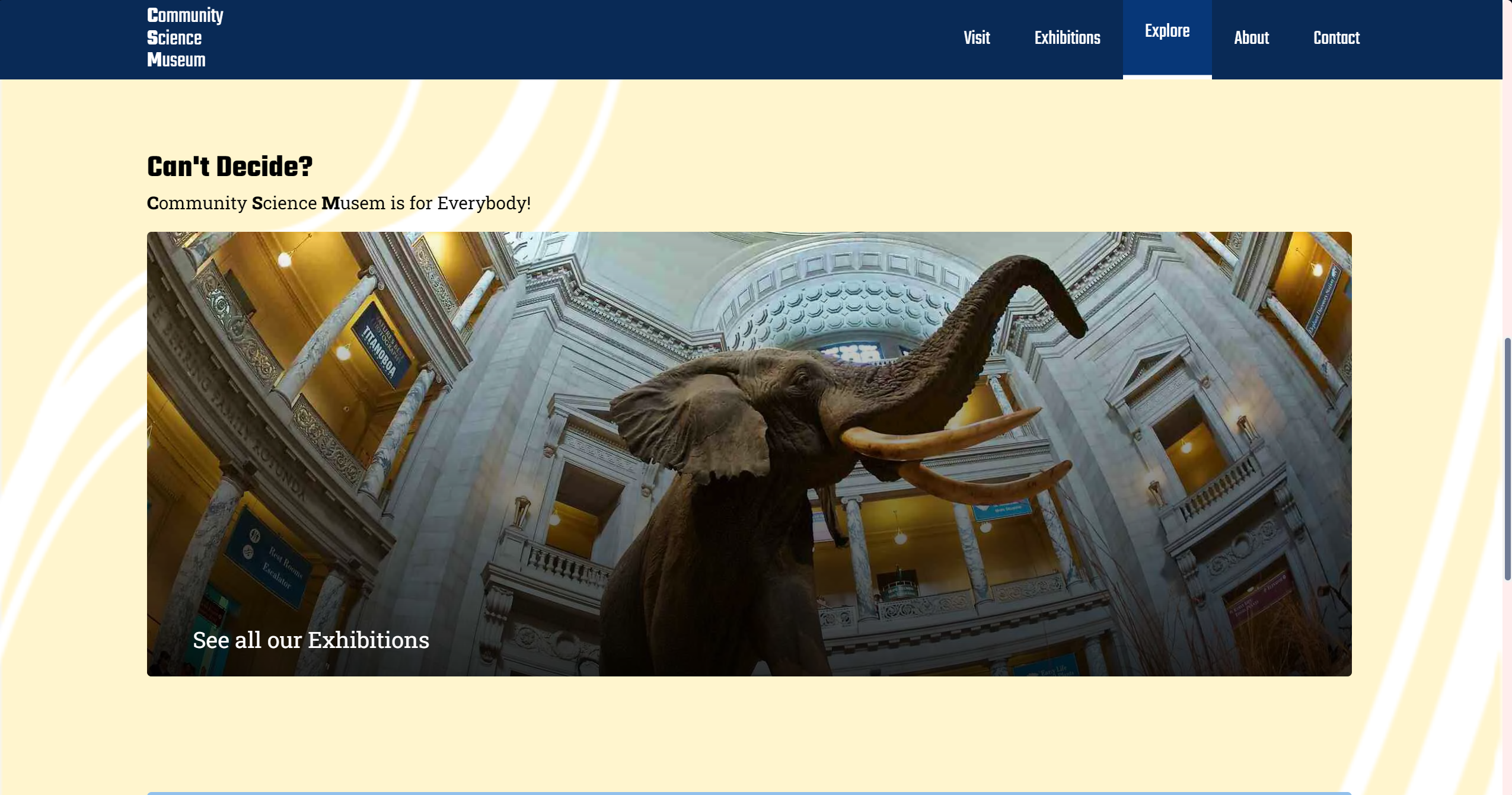 A Screenshot of the PC version of a website called 'Community Science Museum', featuring the websites 'Explore' page. The website includes a section 'Cant Decide?', with a image of a elephant and a text over the image saying 'see all exhibitions'